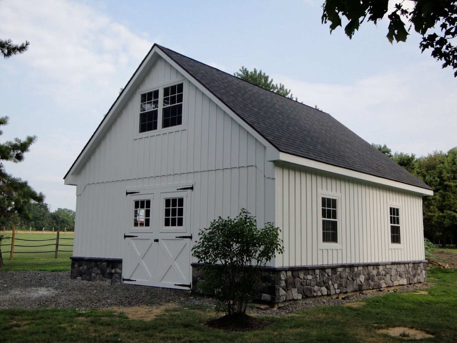 White board and batten steel siding home