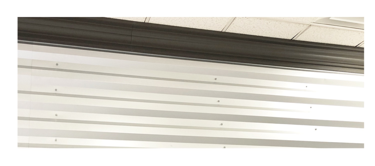 Metal crown molding detail in an office