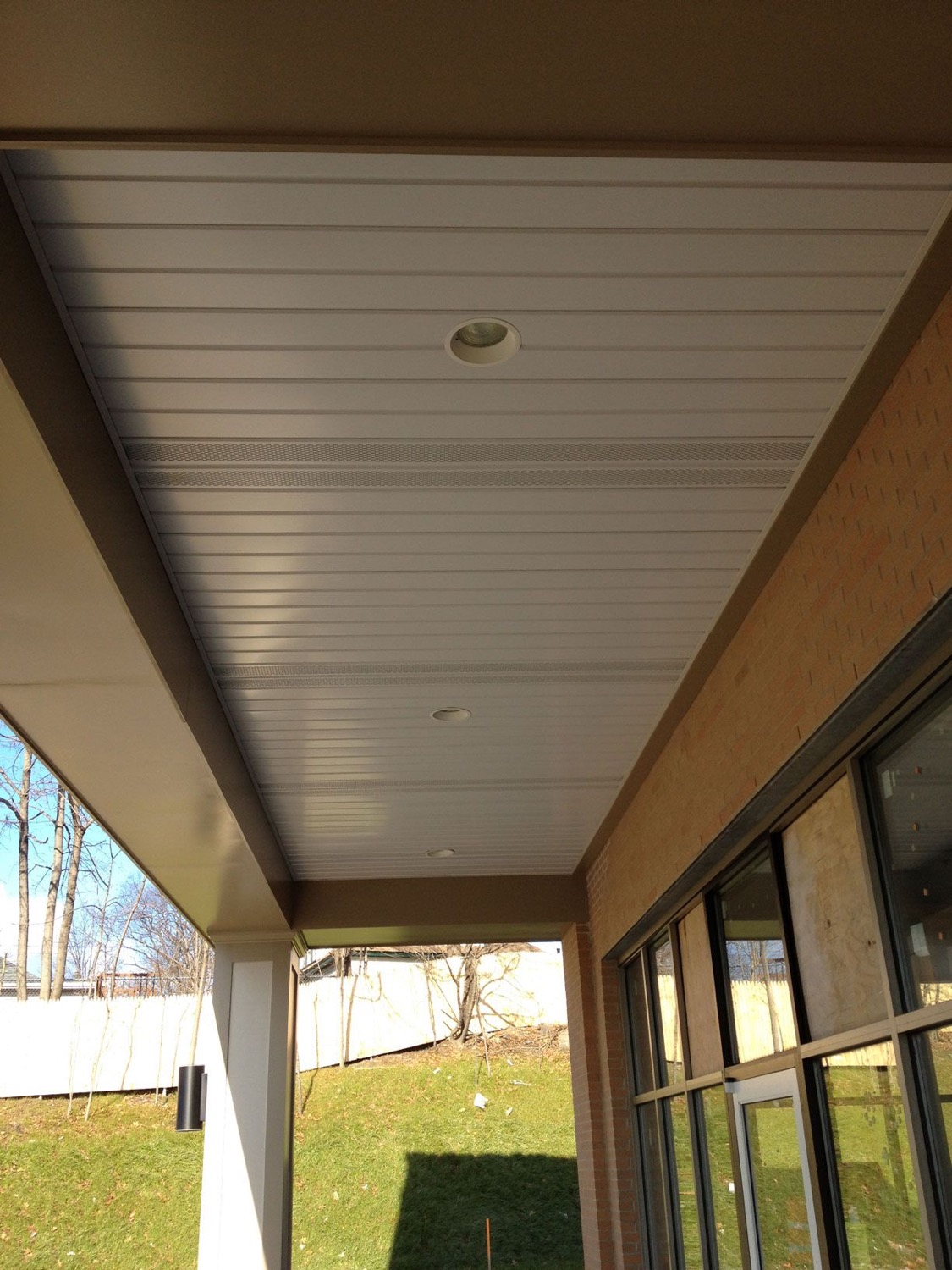 V-soffit steel panel under a deck